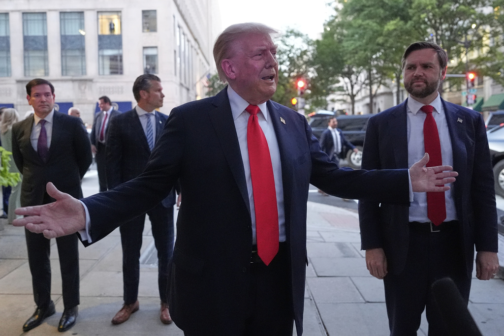 President Donald Trump speaks to reporters before he enters a restaurant near the White House, Tuesday, Sept. 9, 2025, in Washington, to have dinner with Secretary of State Marco Rubio, Defense Secretary Pete Hegseth and Vice President JD Vance. (AP Photo/Alex Brandon)