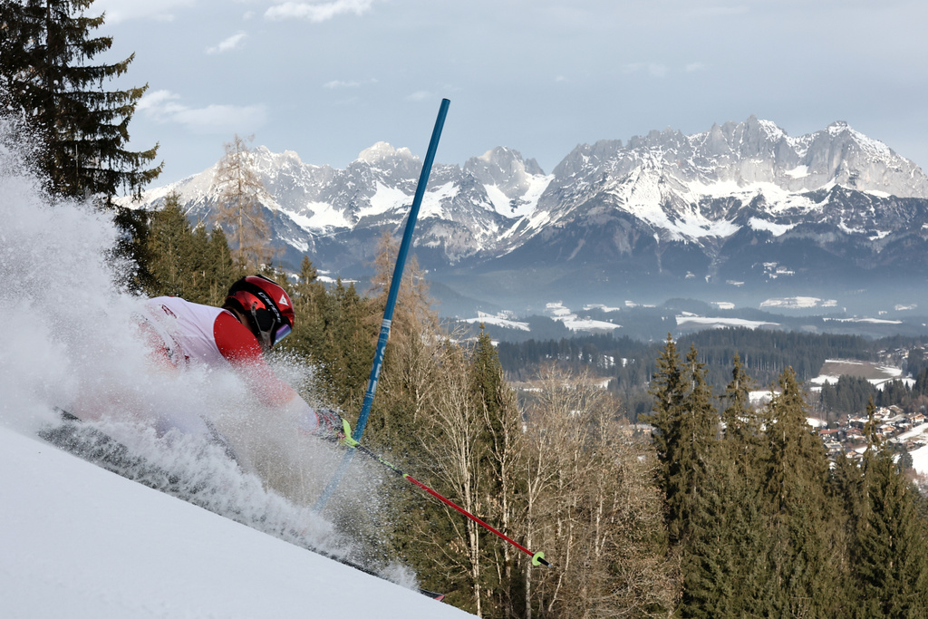 Switzerland's Loic Meillard speeds down the course during an alpine ski, men's World Cup slalom in Kitzbuehel, Austria, Sunday, Jan. 25, 2026. (AP Photo/Gabriele Facciotti)