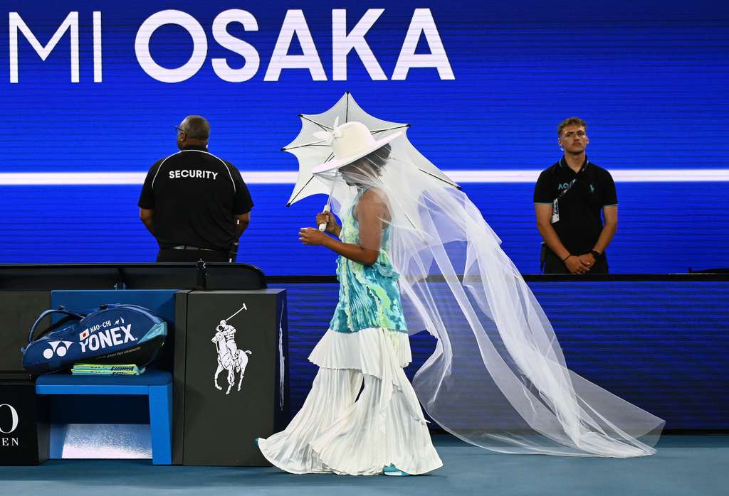 Naomi Osaka of Japan walks onto Rod Laver Arena for her first round match against Antonia Ruzic of Croatia at the Australian Open tennis championship in Melbourne, Australia, Tuesday, Jan. 20, 2026. (Joel Carrett/AAP Image via AP)