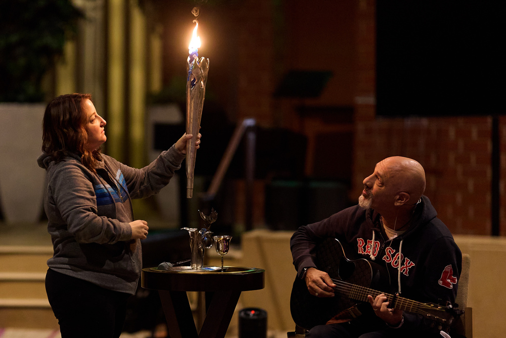 Rabbi Jonathan Aaron plays guitar while Cantor Lizzie Weiss helps during the Havdalah candle ceremony at the conclusion of a sound bath at Temple Emanuel, Saturday, Dec. 6, 2025, in Beverly Hills, Calif. (AP Photo/Allison Dinner)