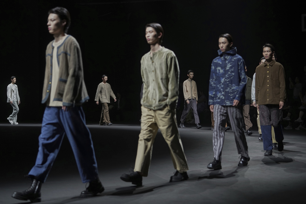 Models present Xiangyuzaowu creations by Xiangyu Kong during the SS2026 China Fashion Week, in Beijing, Monday, Sept. 8, 2025. (AP Photo/Andy Wong)