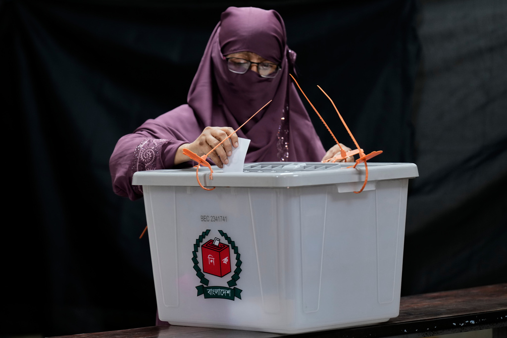 A Bangladeshi woman casts her vote in a polling station during national parliamentary election in Dhaka, Bangladesh, Thursday, Feb. 12, 2026. (AP Photo/Anupam Nath)