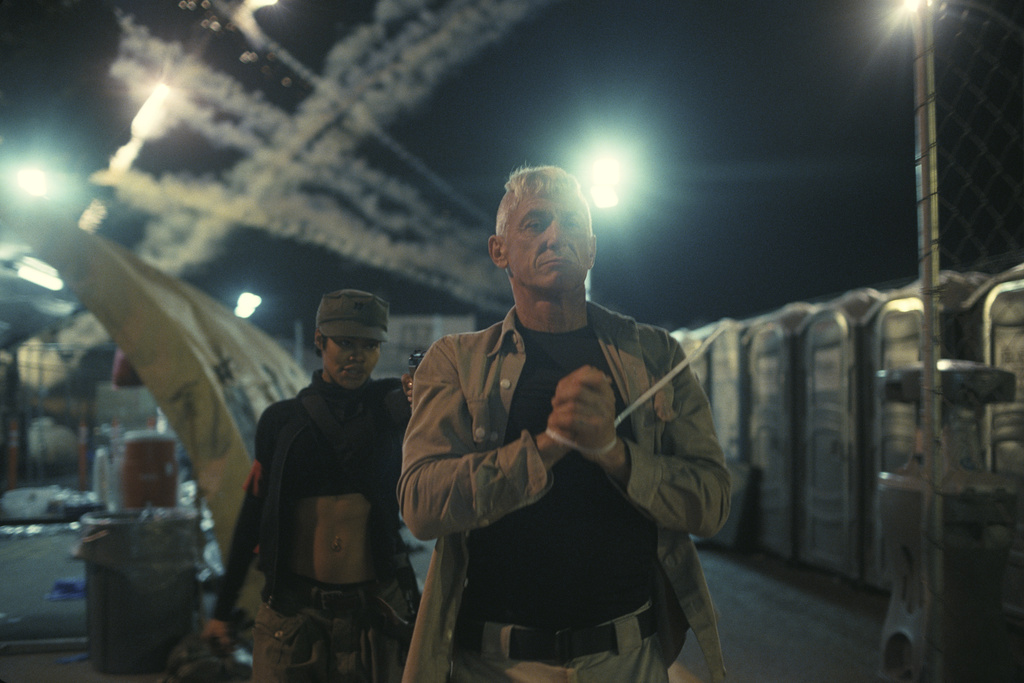 This image released by Warner Bros. Pictures shows Teyana Taylor, left, and Sean Penn in a scene from "One Battle After Another." (Warner Bros. Pictures via AP)