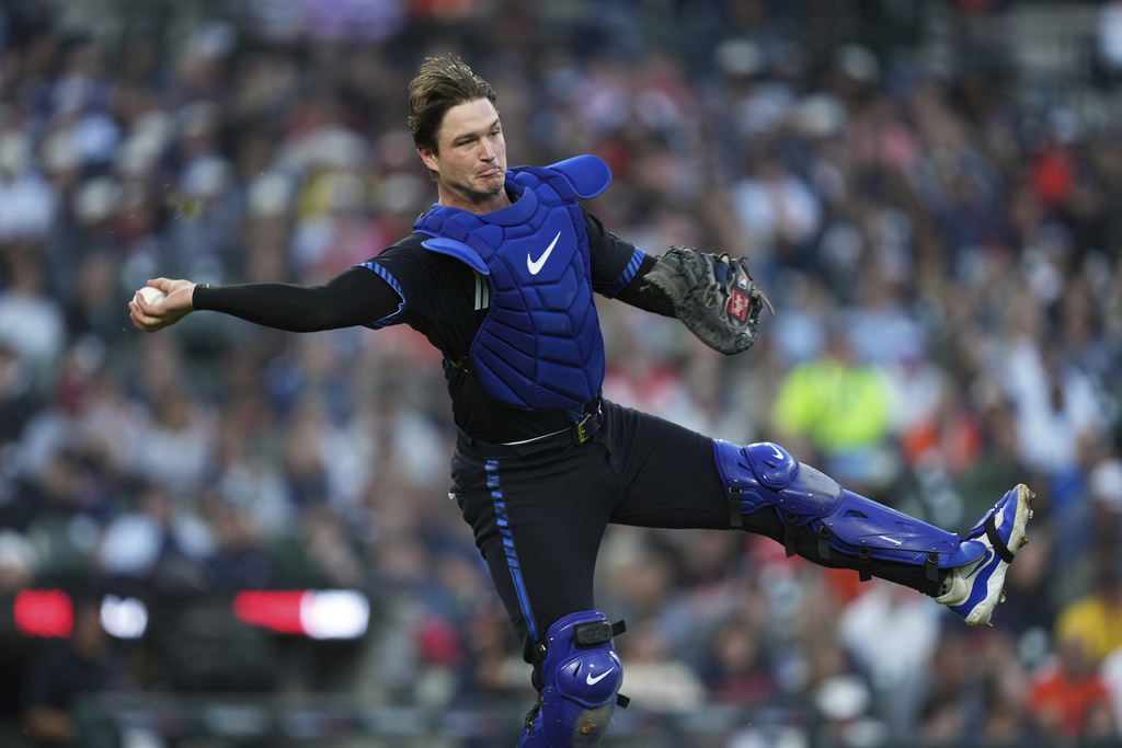 Detroit Tigers catcher Dillon Dingler (13) throws to first base for an out on a Chicago White Sox's Chase Meidroth bunt in the fourth inning during a baseball game Friday, Sept. 5, 2025, in Detroit. (AP Photo/Paul Sancya)