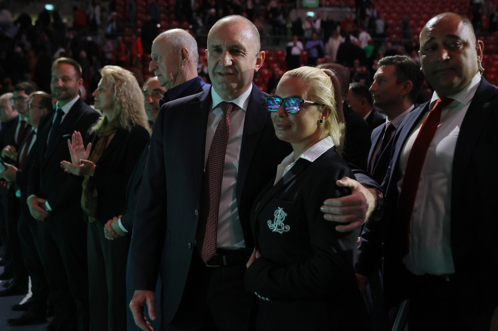 Former Bulgarian President Rumen Radev, center, poses with a supporter at the closing rally of his campaign, in Sofia, Thursday, April 16, 2026, as Bulgaria heads into an early parliamentary election. (AP Photo/Valentina Petrova)