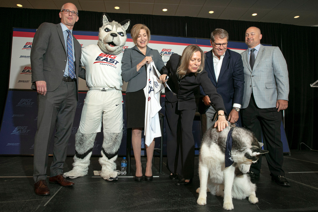 FILE - From left, University of Connecticut men's basketball coach Dan Hurley, University President Susan Herbst, Big East Commissioner Val Ackerman, women's basketball coach Geno Auriemma and Director of Athletics David Benedict, pose for photos during the announcement that the University of Connecticut is re-joining the Big East Conference, at New York's Madison Square Garden, June 27, 2019. (AP Photo/Richard Drew, File)