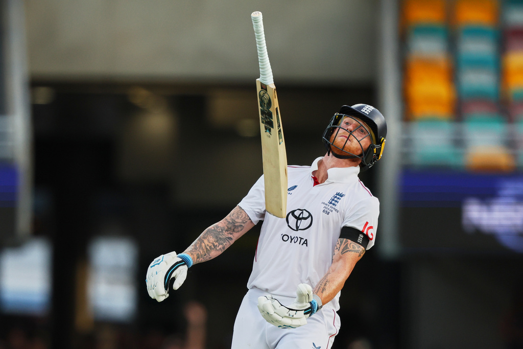 England's captain Ben Stokes throws bat after loosing his wicket during the second Ashes cricket test match between Australia and England in Brisbane, Sunday, Dec. 7, 2025.. (AP Photo/Tertius Pickard)