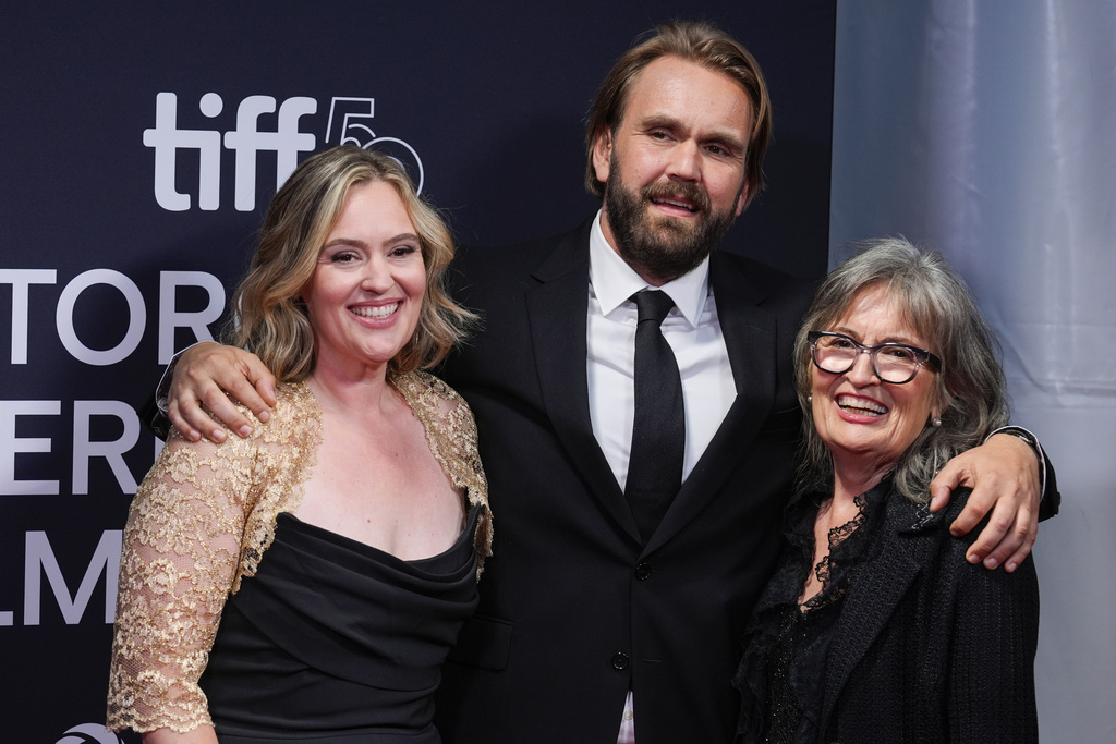 Jennifer Candy-Sullivan, from left, Chris Candy, and Rosemary Margaret Hobor attend the premiere of "John Candy: I Like Me" during the Toronto International Film Festival on Thursday, Sept. 4, 2025, at Roy Thomson Hall in Toronto. (AP Photo/Chris Pizzello)