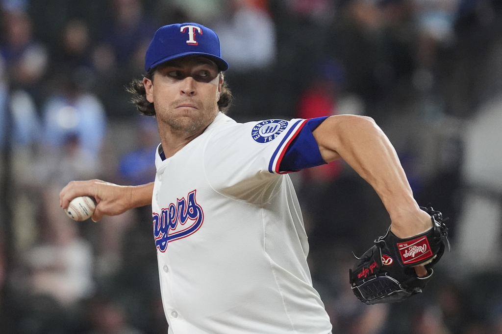 Texas Rangers starting pitcher Jacob deGrom throws during the first inning of a baseball game against the Los Angeles Angels, Monday, Aug. 25, 2025, in Arlington, Texas. (AP Photo/LM Otero)