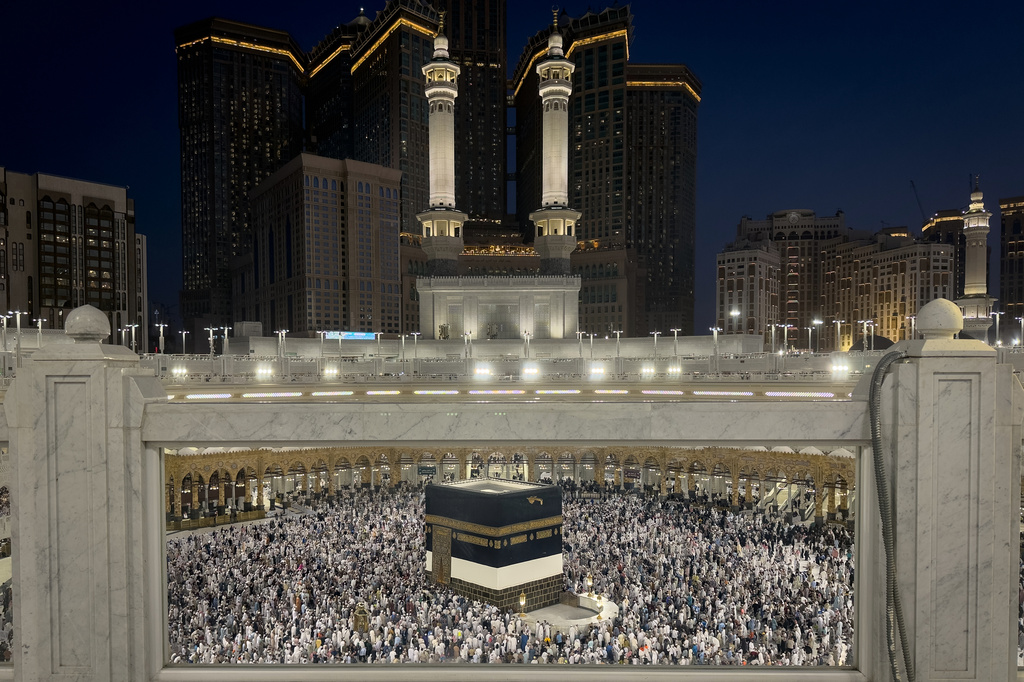 Muslim pilgrims perform the farewell circumambulation called Tawaf al-Wada, around the Kaaba, Islam's holiest site, at the Grand Mosque during the final rites of the annual Hajj pilgrimage in Mecca, Saudi Arabia, Friday, May 29, 2026. (AP Photo/Altaf Qadri)