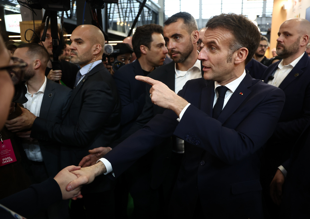 French President Emmanuel Macron attends the International Agriculture Fair during the opening day in Paris, Saturday, Feb. 21, 2026. (Christophe Petit Tesson/Pool Photo via AP)