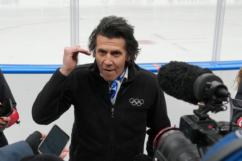 Christophe Dubi, IOC Olympic Games Executive Director, talks to reporters at the Santa Giulia Ice Hockey Arena, in Milan, where Ice Hockey discipline of the Milan Cortina 2026 Winter Olympics will take place, in Milan, Italy, Sunday, Jan. 11, 2026. (AP Photo/Luca Bruno)