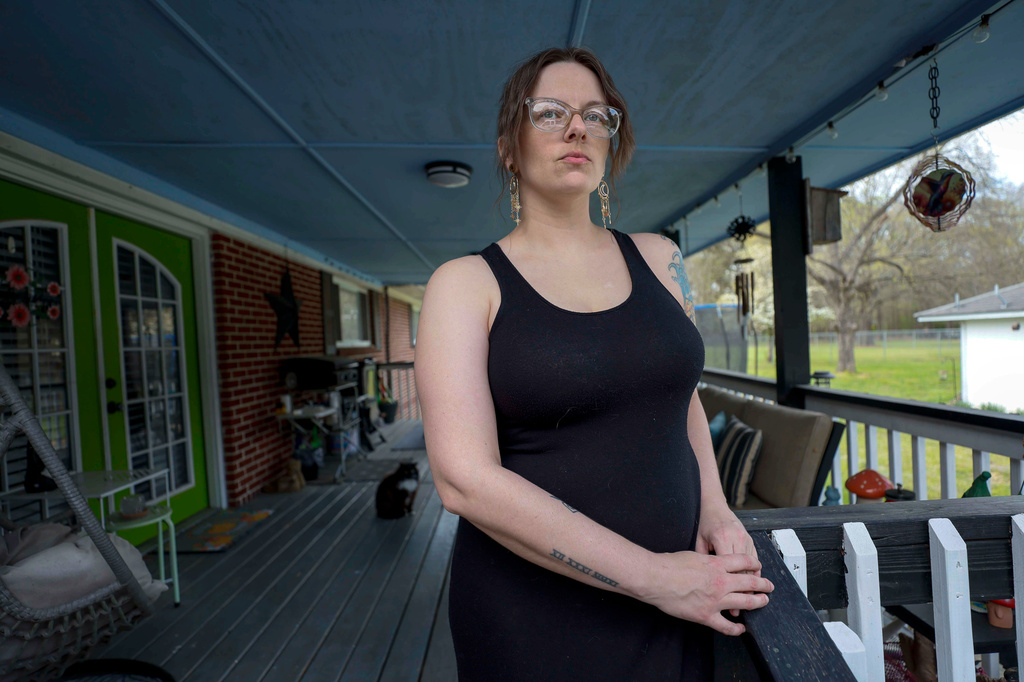 Stormy Bost stands on her porch in Calhoun, Ga., on March 29, 2026. (Miguel Martinez/Atlanta Journal-Constitution via AP)