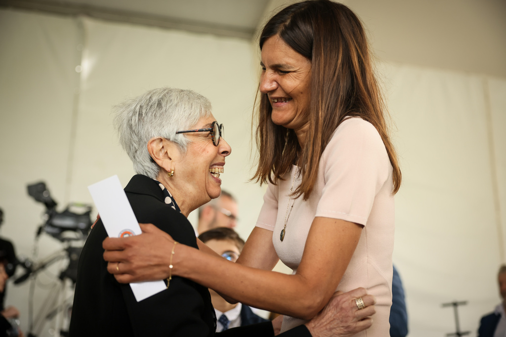 Alice Rufo, Minister Delegate to the Minister of the Armed Forces and Veterans, right, hugs Barbara Nguyen, descendant of Paul Nguyen, recognized as Righteous Among the Nations, left, after the ceremony marking the 84th anniversary of the 1942 Vel d'Hiv police roundup, the largest roundup of Jews in France during World War II, and paying tribute to the Righteous Among the Nations of France, in Paris, Sunday, July 19, 2026. (AP Photo/Thomas Padilla)