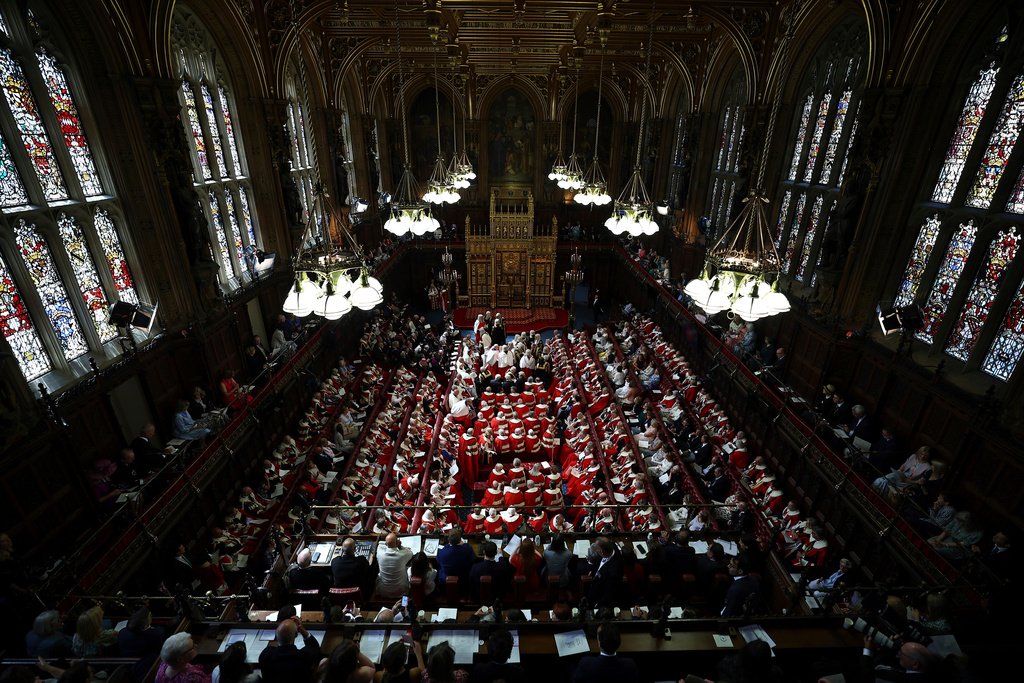 FILE - Members of the House of Lords and guests take their seats in the Lords Chamber, ahead of the State Opening of Parliament, in the Houses of Parliament, in London, July 17, 2024. (Henry Nicholls/POOL via AP, File)