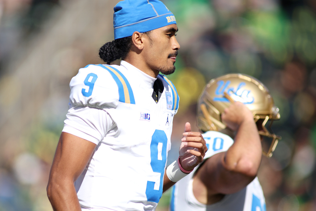 UCLA quarterback Nico Iamaleava (9) warms up before an NCAA college football game against Oregon, Saturday, Oct. 10, 2026, in Eugene, Ore. (AP Photo/Lydia Ely)