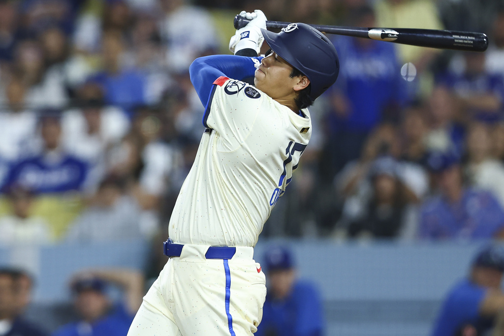 Los Angeles Dodgers designated hitter Shohei Ohtani follows through on a swing during the seventh inning of a baseball game against the Toronto Blue Jays, Saturday, Aug. 9, 2025, in Los Angeles. (AP Photo/Jessie Alcheh)