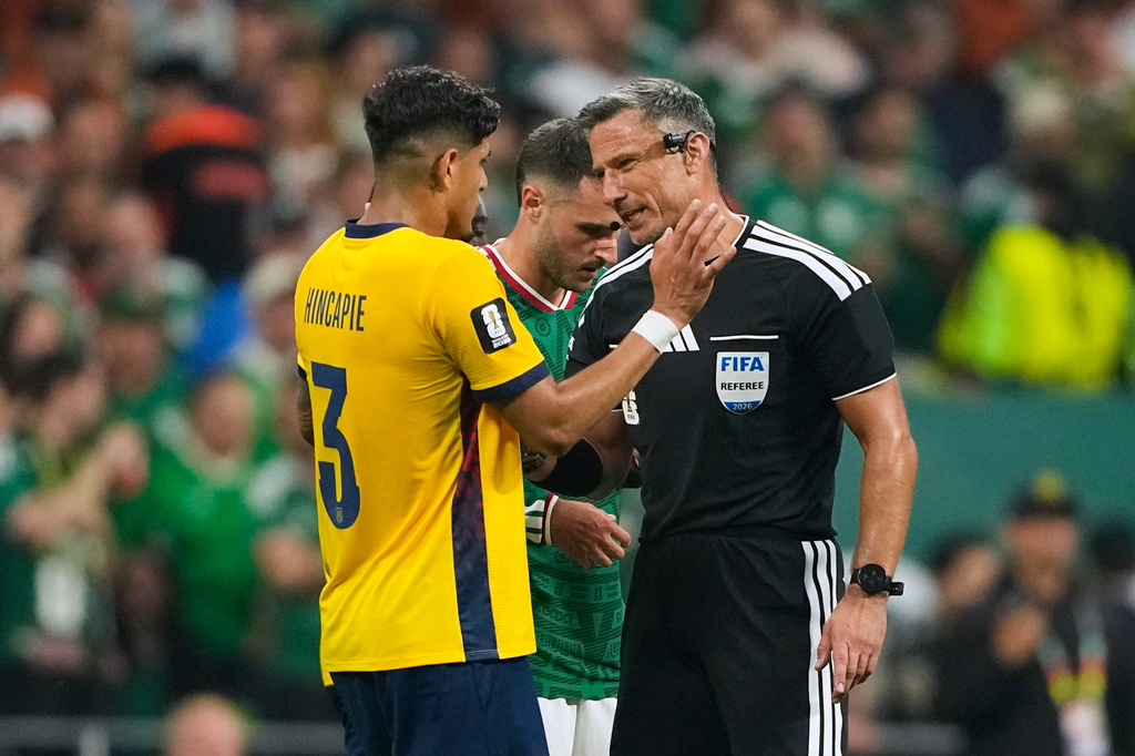 Referee Slavko Vincic of Slovenia speaks to Ecuador's Piero Hincapie (3) before sending him from the field during the World Cup round of 32 soccer match between Mexico and Ecuador in Mexico City, Tuesday, June 30, 2026. (AP Photo/Natacha Pisarenko)