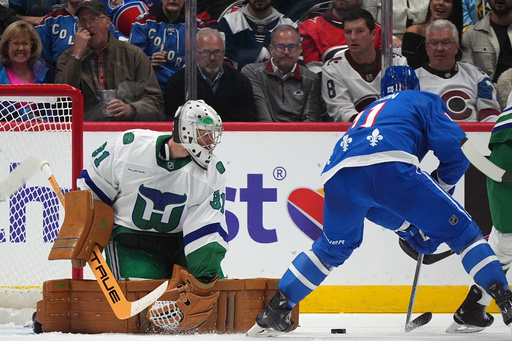 Carolina Hurricanes goaltender Frederik Andersen, left, deflects a shot from Colorado Avalanche center Brock Nelson in the second period of an NHL hockey game, Thursday, Oct. 23, 2025, in Denver. (AP Photo/David Zalubowski) Carolina Hurricanes goaltender Frederik Andersen, left, deflects a shot from Colorado Avalanche center Brock Nelson in the second period of an NHL hockey game, Thursday, Oct. 23, 2025, in Denver. (AP Photo/David Zalubowski)