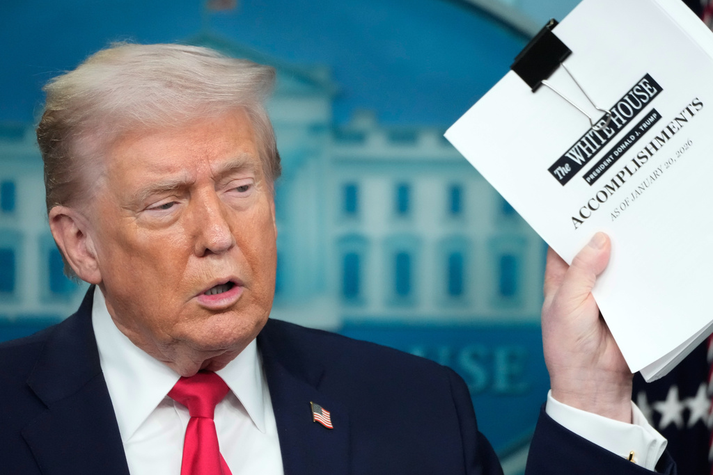 President Donald Trump speaks during a press briefing at the White House in Washington, Tuesday, Jan. 20, 2026. (AP Photo/Mark Schiefelbein)