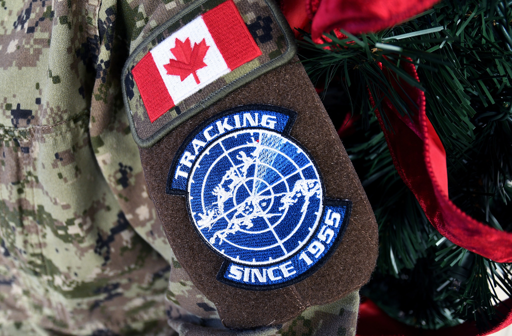 A patch representing the annual NORAD Tracks Santa Operation is seen on a military uniform sleeve at Peterson Space Force Base in Colorado Springs, Colo., on Thursday, Dec. 18, 2025. (AP Photo/Thomas Peipert)