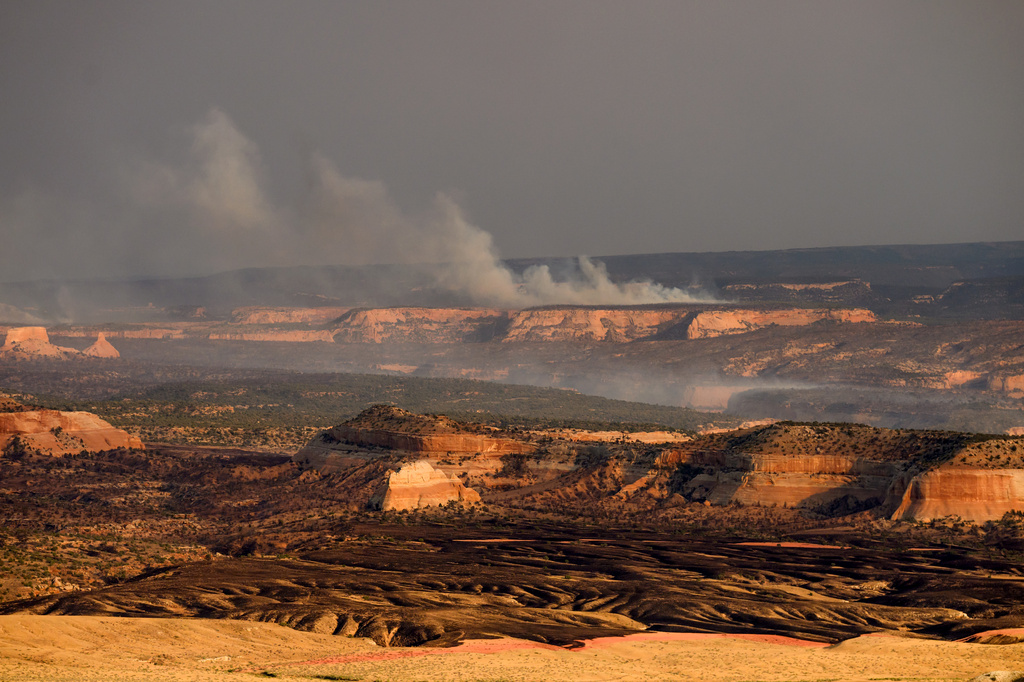 Smoke rises from the Snyder Fire burning near Thompson Springs, Utah, on Sunday, June 28, 2026. (AP Photo/Noah Berger)