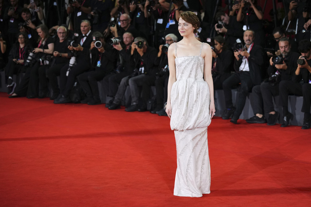 Emma Stone poses for photographers on the red carpet for the film 'Bugonia' during the 82nd edition of the Venice Film Festival in Venice, Italy, on Thursday, Aug. 28, 2025. (Photo by Alessandra Tarantino/Invision/AP)