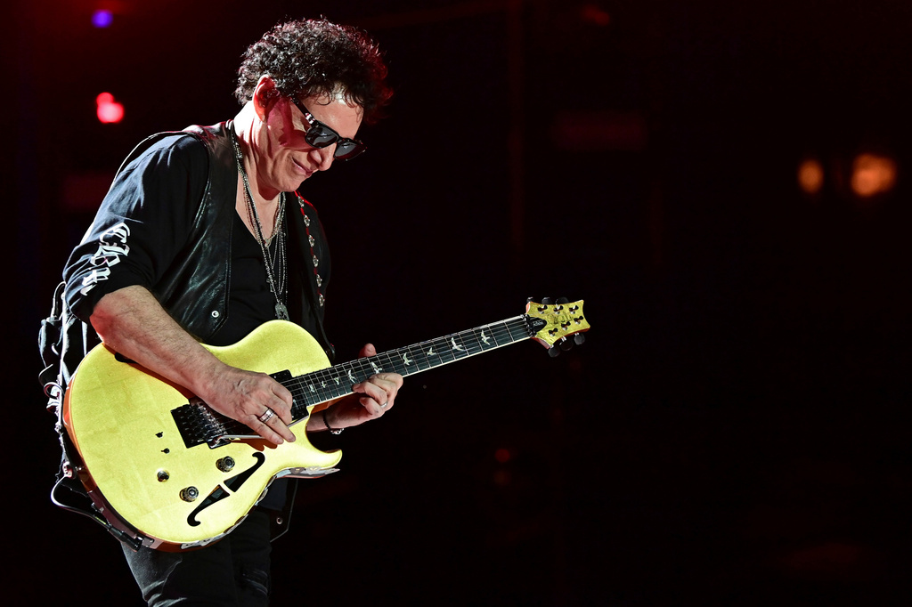 FILE - Neal Schon, of Journey, performs in Canton, Ohio, on Aug. 6, 2022. (AP Photo/David Dermer, File)