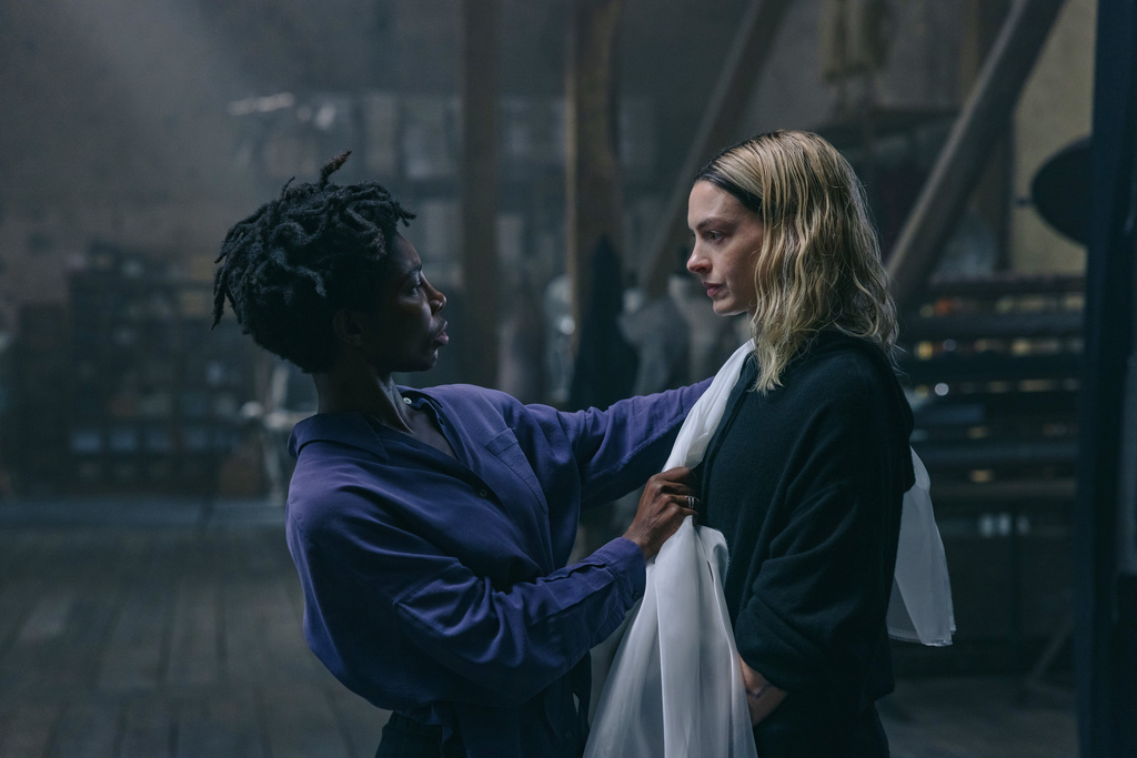 This image released by A24 shows Michaela Coel, left, and Anne Hathaway in a scene from "Mother Mary." (Eric Zachanowich/A24 via AP)