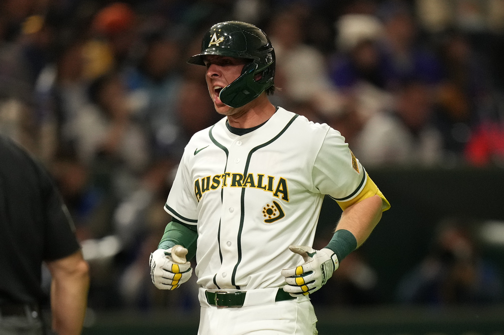 Australia's catcher Robbie Perkins celebrates after hits a two-run home run against Taiwan in the fifth inning of a World Baseball Classic game in Tokyo, Thursday, March 5, 2026. (AP Photo/Hiro Komae)