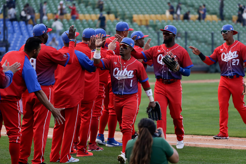FILE - Cuba's team members celebrate their win over Panama during a Pool A game for the World Baseball Classic (WBC) at Taichung Intercontinental Baseball Stadium in Taichung, Taiwan, March 10, 2023. (AP Photo/I-Hwa Cheng, File)