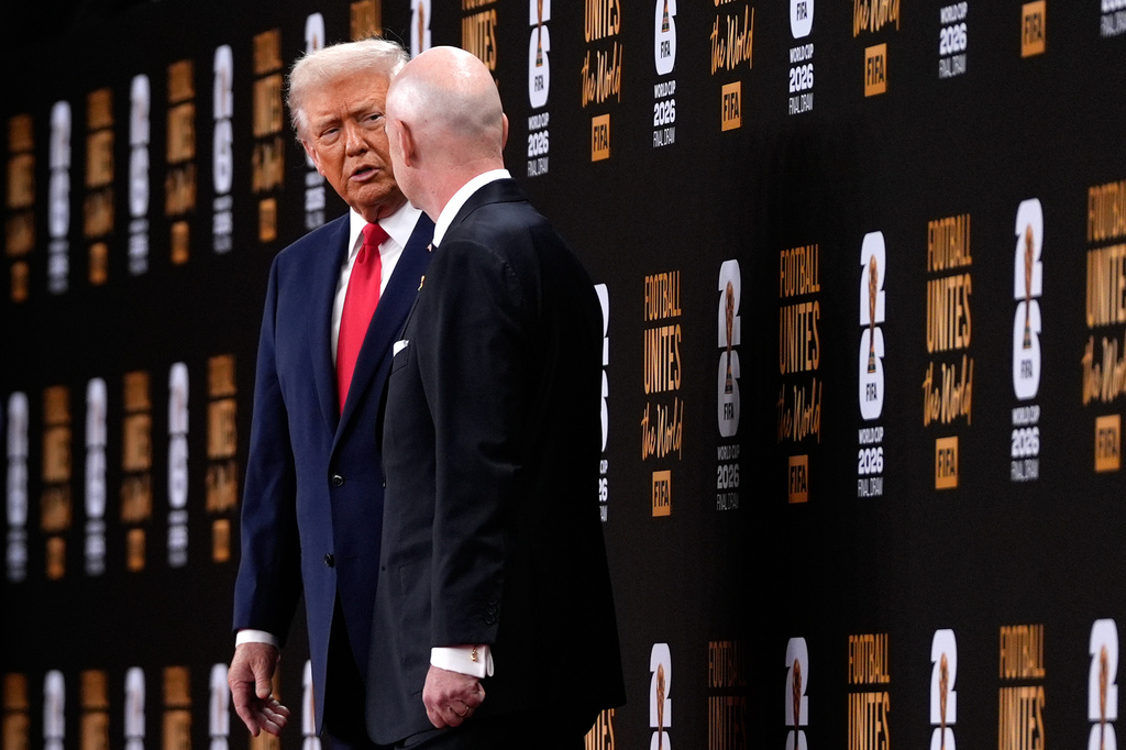 President Donald Trump speaks with FIFA President Gianni Infantino as they leave after the draw for the 2026 soccer World Cup at the Kennedy Center in Washington, Friday, Dec. 5, 2025. (AP Photo/Julia Demaree Nikhinson)