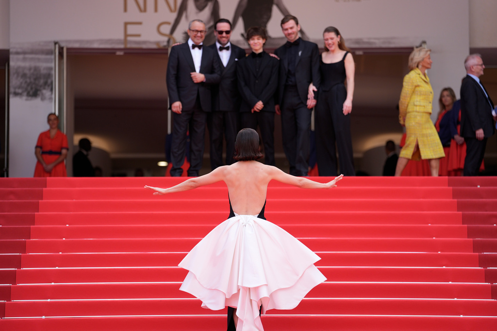 Iris Lebedeva, front, director Andrey Zvyagintsev, from left, Dmitriy Mazurov, Yuriy Zavalnyouk, fourth from left and Varvara Shmykova pose for photographers upon arrival at the premiere of the film 'Minotaur' at the 79th international film festival, Cannes, southern France, Tuesday, May 19, 2026. (AP Photo/John Locher)