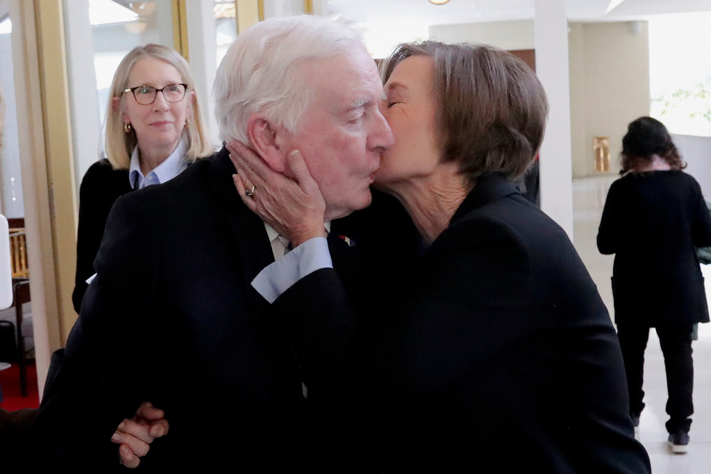 FILE - North Carolina Lt. Gov. Rachel Hunt, right, kisses her father, former North Carolina Gov. Jim Hunt, left, after she presided over the Senate session at the Legislative Building, Jan. 8, 2025, in Raleigh, N.C. (AP Photo/Chris Seward, File)