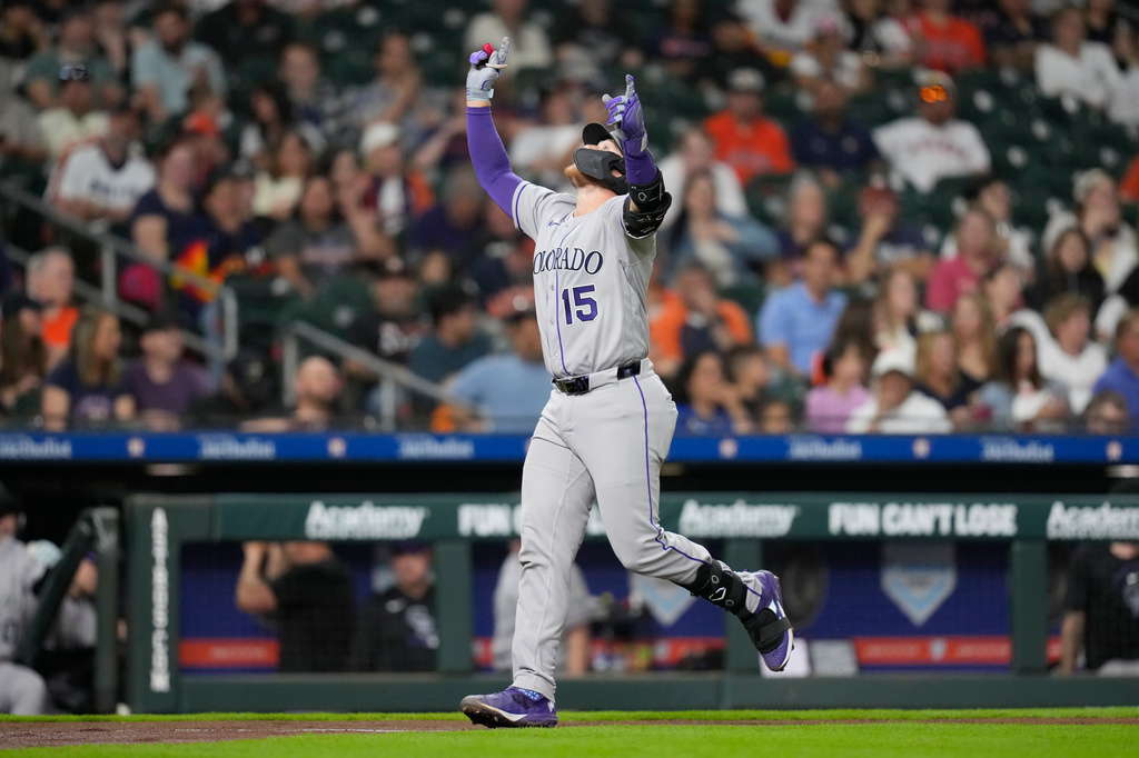 Colorado Rockies' Hunter Goodman celebrates after hitting a home run against the Houston Astros during the fourth inning of a baseball game Thursday, April 16, 2026, in Houston. (AP Photo/David J. Phillip)
