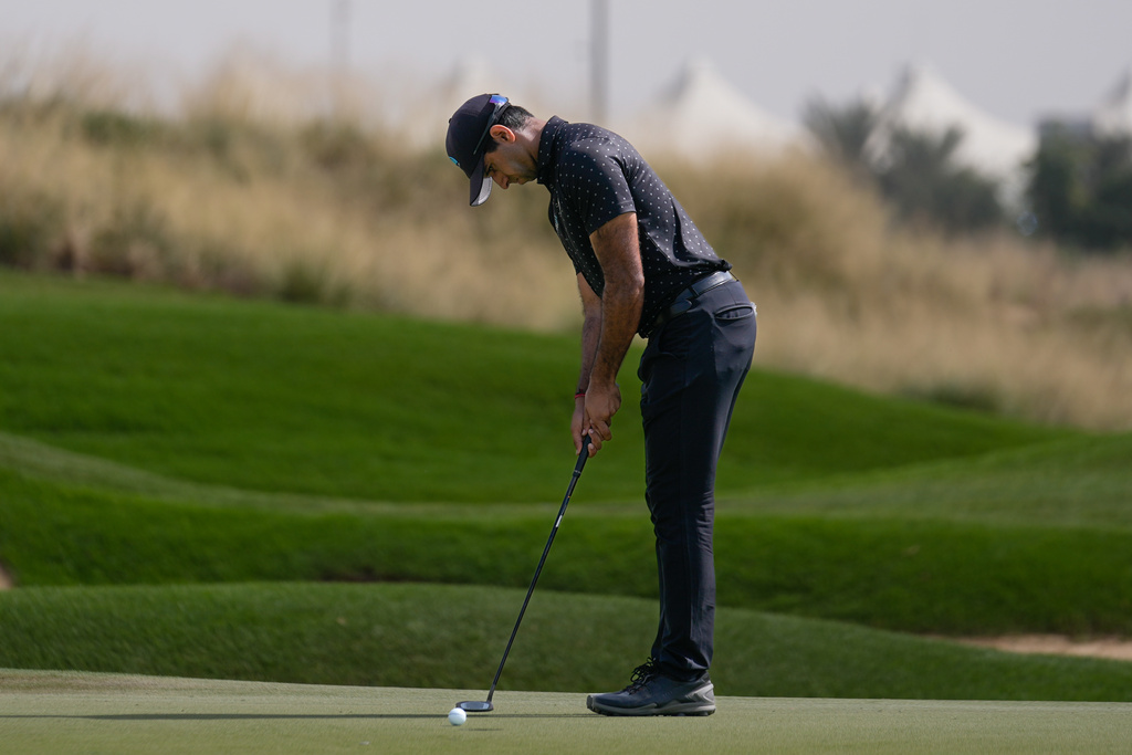 Aaron Rai of England plays a shot on the 4th green during the third round of the Abu Dhabi Golf Championship in Abu Dhabi, United Arab Emirates, Saturday, Nov. 8, 2025. (AP Photo/Altaf Qadri)