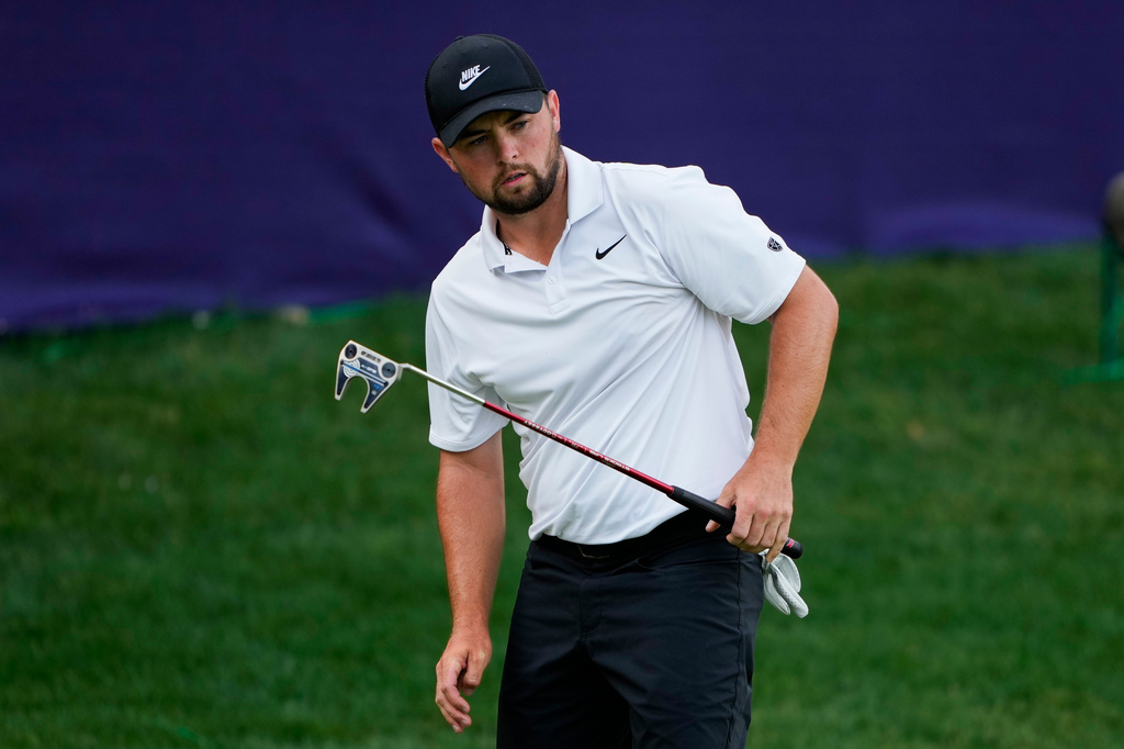 Alex Fitzpatrick, of England, follows his shot on the 15gh green during third round of the Truist Championship golf tournament at the Quail Hollow Club, Saturday, May 9, 2026, in Charlotte, N.C. (AP Photo/Chris Carlson)