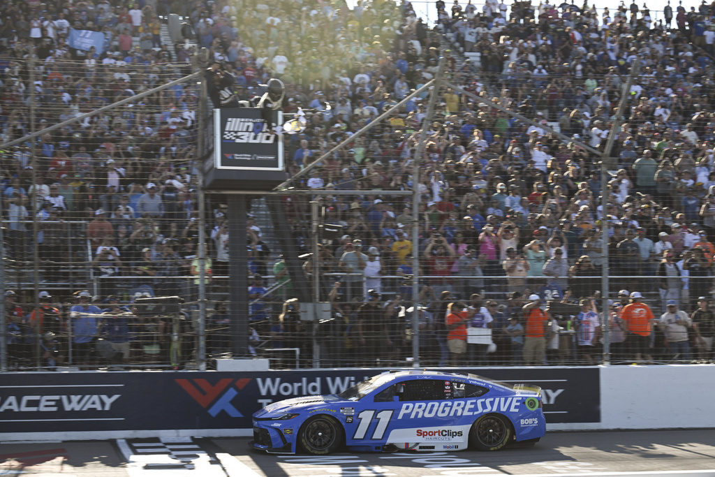 Denny Hamlin (11) wins a NASCAR Cup Series auto race at World Wide Technology Raceway, Sunday, Sept. 7, 2025, in Madison, Ill. (AP Photo/Connor Hamilton)