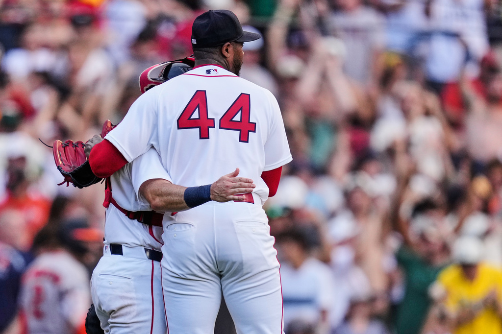 Boston Red Sox's Aroldis Chapman is congratulated by catcher Connor Wong after they defeated the Baltimore Orioles in the first baseball game of a doubleheader, Wednesday, July 22, 2026, in Boston. (AP Photo/Charles Krupa)
