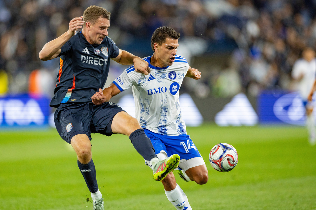 San Diego FC defender Christopher McVey, left, challenges for the ball with CF Montreal forward Daniel Rios (14) during the second half of an MLS soccer match, Saturday, Feb. 21, 2026, in San Diego. (AP Photo/Tony Ding)