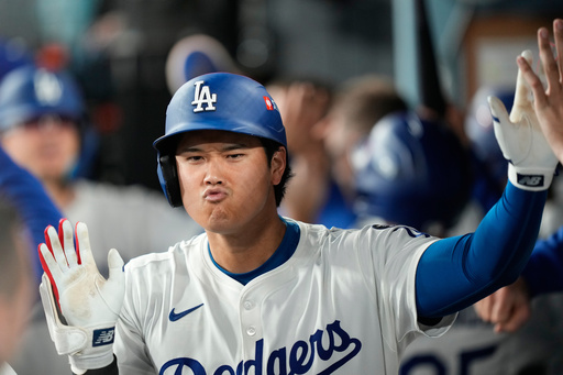 Los Angeles Dodgers' Shohei Ohtani celebrates after his two-run home run during the sixth inning in Game 1 of the National League Wild Card baseball playoff series against the Cincinnati Reds, Tuesday, Sept. 30, 2025, in Los Angeles. (AP Photo/Mark J. Terrill) Los Angeles Dodgers' Shohei Ohtani celebrates after his two-run home run during the sixth inning in Game 1 of the National League Wild Card baseball playoff series against the Cincinnati Reds, Tuesday, Sept. 30, 2025, in Los Angeles. (AP Photo/Mark J. Terrill)