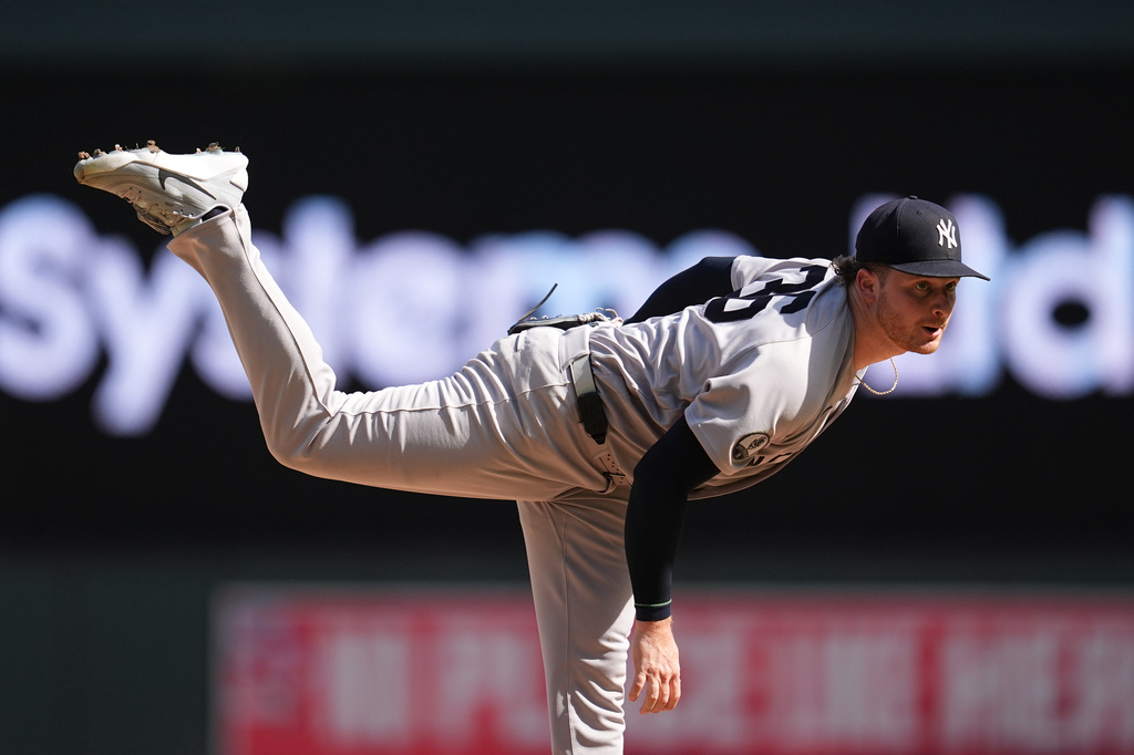 New York Yankees relief pitcher Clarke Schmidt follows through on a pitch during the seventh inning of a baseball game against the Minnesota Twins, Wednesday, Sept. 16, 2026, in Minneapolis. (AP Photo/Abbie Parr)