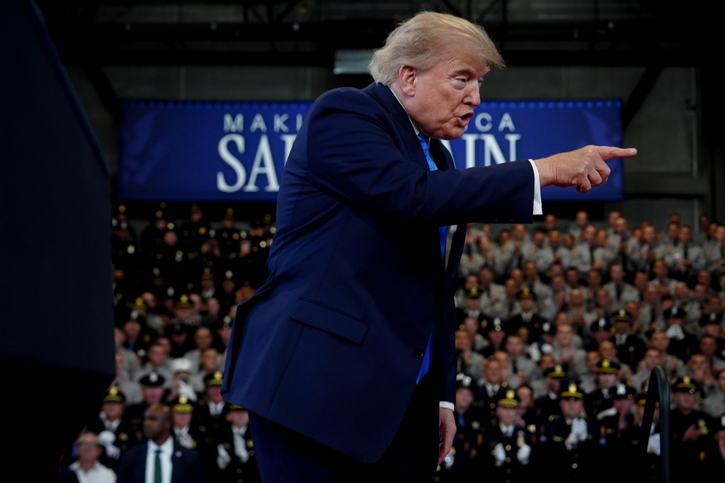 President Donald Trump arrives to speak at the David Mack Center for Training and Intelligence, Friday, Aug. 14, 2026, in Garden City, N.Y. (AP Photo/Julia Demaree Nikhinson)
