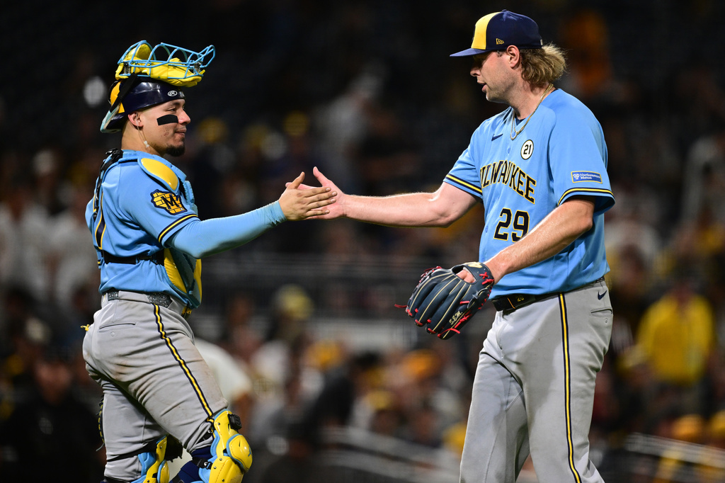 Milwaukee Brewers pitcher Trevor Megill is congratulated by catcher William Contreras after the Brewers defeated the Pittsburgh Pirates in a baseball game, Tuesday, Sept. 15, 2026, in Pittsburgh. (AP Photo/David Dermer)
