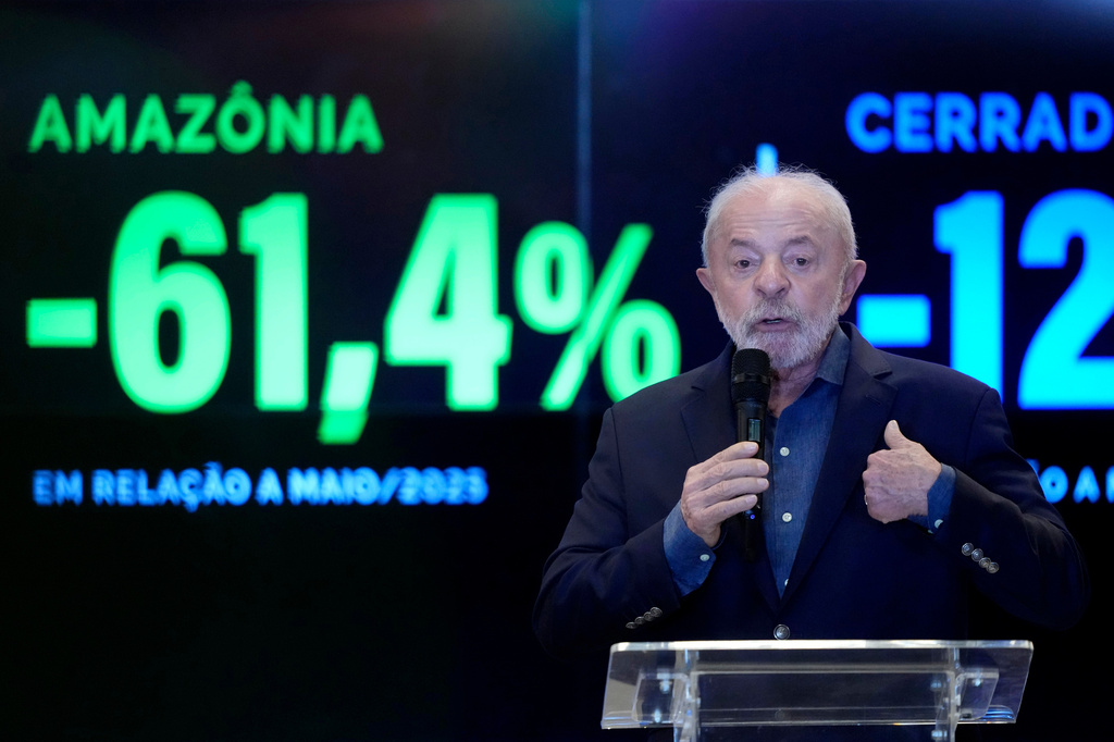Brazilian President Luiz Inacio Lula da Silva speaks in front of a screen displaying a 61.4% decrease in Amazon deforestation compared with May 2025 during a visit to the Amazon Regional Observatory of the Amazon Cooperation Treaty Organization in Brasilia, Brazil, Thursday, June 11, 2026. (AP Photo/Eraldo Peres)