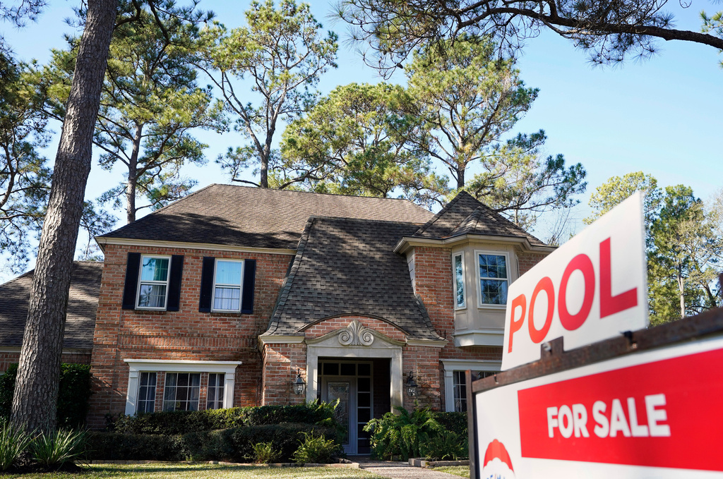 FILE - A real estate sign is shown at a home for sale in Houston, Jan. 13, 2021. (Melissa Phillip/Houston Chronicle via AP, File)