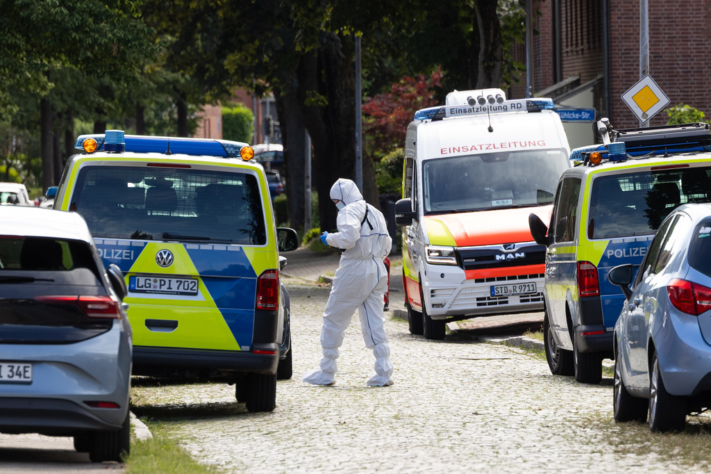 Forensic investigators on a street in Stade, Germany Monday, June 29, 2026 following a shooting. (Ulrich Perrey/dpa/dpa via AP)
