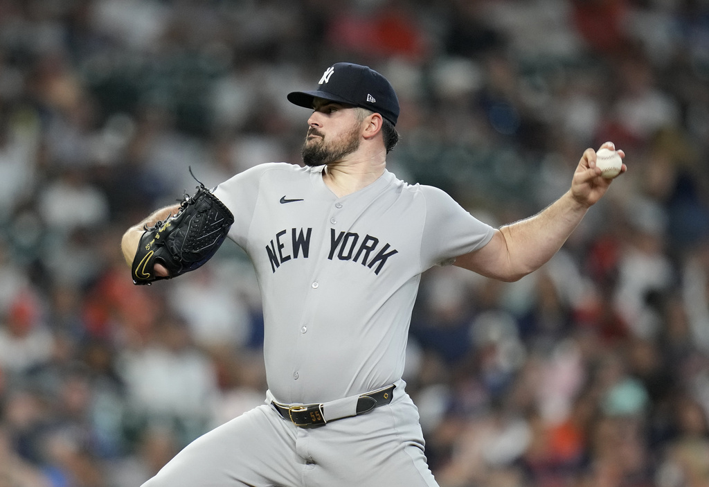 New York Yankees starting pitcher Carlos Rodon delivers against Houston Astros' Jeremy Peña during the first inning of a baseball game Thursday, Sept. 4, 2025, in Houston. (AP Photo/Karen Warren)