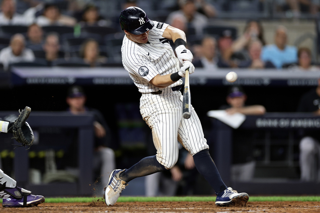 New York Yankees' Anthony Volpe hits a grand slam during the seventh inning of a baseball game against the Colorado Rockies, Thursday, Sept. 10, 2026, in New York. (AP Photo/Adam Hunger)