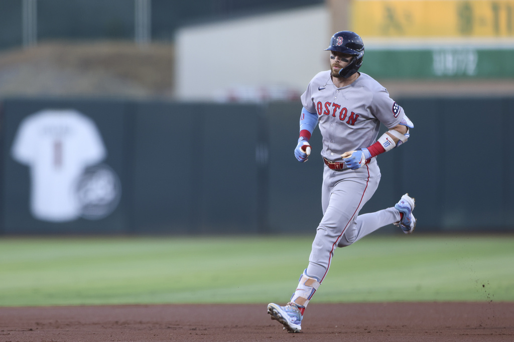 Boston Red Sox's Trevor Story jogs around the bases after hitting a solo home during the first inning of a baseball game against the Athletics, Monday, Sept. 8, 2025, in West Sacramento, Calif. (AP Photo/Scott Marshall)